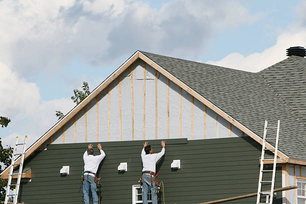 Professional Storm Damage Siding Repair technician working in Landisburg, PA